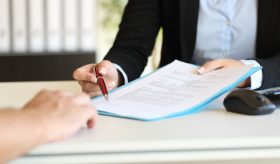 Executive Hands Indicating Where To Sign Contract